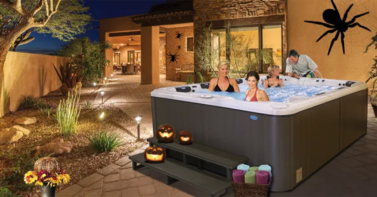 A family celebrating Halloween in a spooky Cal Spas hot tub.